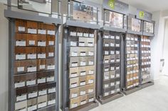 a room filled with lots of different types of drawers next to each other on the wall