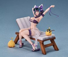 a figurine sitting on top of a wooden chair