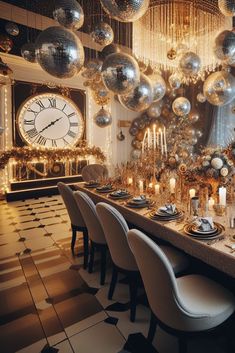 a long table with many silver balloons hanging from the ceiling and candles in front of it