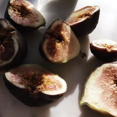 figs cut in half on a white plate