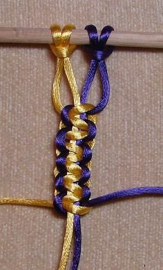 a close up of a piece of cloth with two different colored ropes attached to it