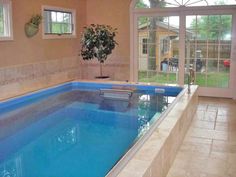 a large indoor swimming pool in a home