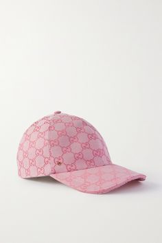 Gucci's instantly recognizable baseball cap is jacquard-woven with the label's signature 'GG' monogram. It's been crafted in Italy from tonal-pink canvas and embellished with a small logo plaque. Adjust the leather tab at the back for a secure fit. Gucci Cap Outfit Women, Designer Hats For Women, Pink Caps, Designer Snapback Baseball Cap With Embroidered Logo, Designer Hats With Logo And Curved Brim, Trendy Luxury Pink Hats, Gucci Pink, Luxury Logo Snapback Hats, Luxury Baseball Cap With Embroidered Logo And Visor