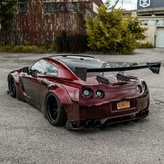 a red sports car parked in a parking lot