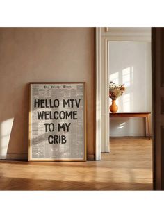 a sign that reads hello my welcome to my crib on the floor in front of a window