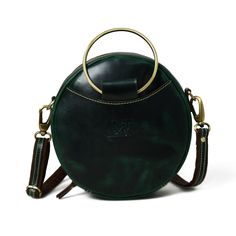 Introducing our latest fashion marvel -Rosie Sling Circle Bag. This unique and stylish accessory is designed to make a bold statement wherever you go. Crafted from high-quality dark green buffalo leather, it exudes an air of sophistication and elegance, while its circular shape adds a touch of whimsy to your ensemble. The trendy and practical sling design allows you to carry your essentials comfortably and in style, leaving your hands free for whatever the day holds. Whether you're heading to a Sling Design, Buffalo Leather, Stylish Accessories, Bag Pattern, Hands Free, Running Errands, Dark Green, Leather Bag