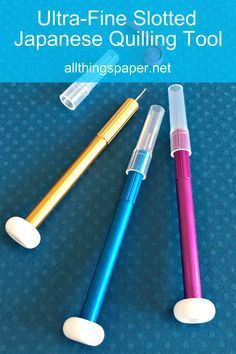 three different colored pens sitting next to each other on a blue surface with text that reads ultra - fine slotted japanese quilting tool