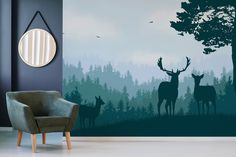 two deer are standing in the forest wall mural