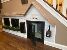 the dog house is built into the floor and has plants growing out of it's windows