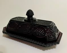 a black decorative object sitting on top of a table