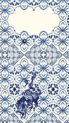 a blue and white pattern with a man on a horse in the middle of it