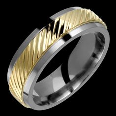 two tone gold and silver wedding ring with an intricate design on the inside of it