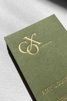 Satin gold foil stamped business cards, using a wild green card. Olive Green Packaging Design, Luxury Green Packaging, Green Gold Packaging, Olive Green Branding, Green Gold Branding, Green And Gold Branding, Debossed Business Card, Gold Foil Packaging, Gold Stationery