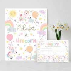 a unicorn themed birthday card next to a vase with flowers and balloons on the table