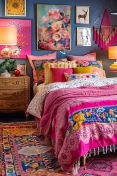 a bedroom decorated in bright colors with pictures on the wall