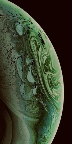 an image of the planet with green and blue swirls on it's surface