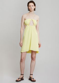 Color: Elfin Yellow Woven jersey with stretch Relaxed silhouette Mini length Halter neck spaghetti straps ties Cut out detail waist to back Tie straps on back 100% Viscose Machine Wash By ROTATE Birger Christensen. Imported Model is 179cm/5'10" wearing a size 36DK/4US Spring Backless Sundress With Crisscross Straps, Strapless Backless Dress For Spring Brunch, Spring Backless Dress With Straps For Brunch, Summer Backless Dress With Crisscross Straps For Brunch, Summer Brunch Backless Dress With Crisscross Straps, Casual Backless Dress With Spaghetti Straps And Tie Back, Strappy Halter Dress For Beach In Spring, Spring Beach Halter Dress With Strappy Design, Spring Backless Strappy Dress