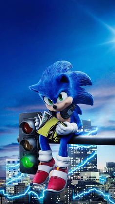 sonic the hedgehog sitting on top of a traffic light with city lights in the background