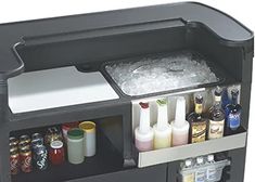 the cooler is filled with drinks and condiments to make it easier for people to drink