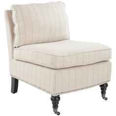 an upholstered chair with black legs and a white stripe fabric on the back