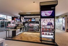 the inside of a cosmetics store with lots of products on display