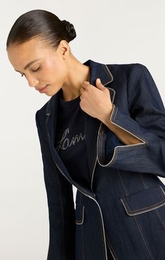 Elevate your style with the Danicka Blazer. Crafted with indigo denim, it features a chic blazer silhouette, collared neckline, and notched lapels. Complete with flap pockets and metallic piping, this blazer adds a touch of sophistication to any look. Upgrade your wardrobe today. Details Button frontFabric: Indigo DenimTailored silhouetteMetallic pipingLong sleeve Content and Care 77% Cotton 21% Polyester 2% ElastaneDry Clean OnlyImported Measurements 27.5in/69.85cm from shoulderMeasurements fro Skirt Coverup, Chic Blazer, Grooming Tips, Cinq A Sept, Short Denim Skirt, Evening Tops, Blazer Blue, Indigo Denim, Denim Outerwear