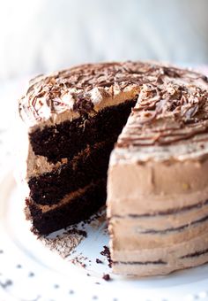 a chocolate cake with one slice missing from it