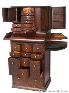 an old wooden desk with drawers and shelves on it's sides, in the shape of a bookcase