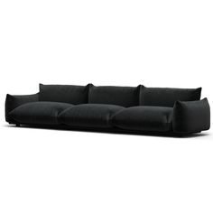 a black couch sitting on top of a white floor