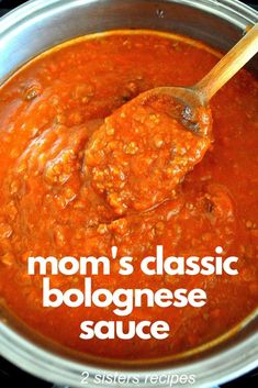 a ladle full of red sauce with the words mom's classic bolognaese sauce