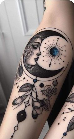 two tattoos on both legs with the moon and stars above them, one has a blue eye