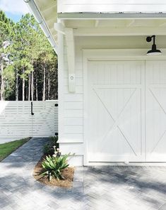 a white house with an attached garage door