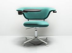 an office chair sitting on top of a white floor next to a wall with a light blue upholstered seat