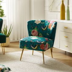 a green chair sitting in front of a white dresser