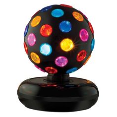 a colorful light up ball sitting on top of a black stand with multi colored lights