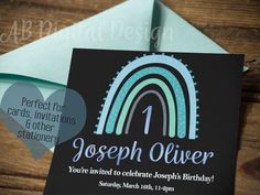 a birthday card with a rainbow design on the front and back, sitting on top of an envelope