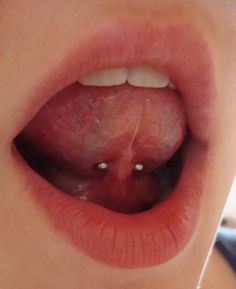 a close up of a person's tongue with an unidentifiable substance on it