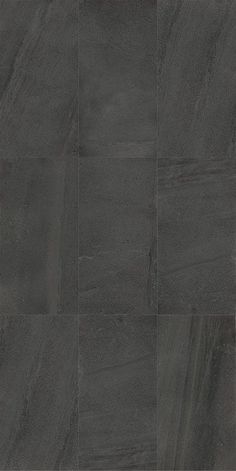 an image of a black tile floor with dark grey tiles on the bottom and sides