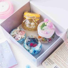 an open box with some decorative items in it