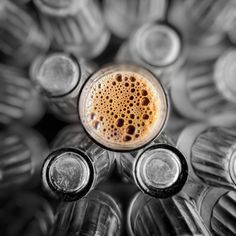 a group of empty beer bottles sitting next to each other