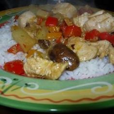 a green plate topped with rice and meat