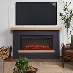 a living room with a fireplace and television mounted on the wall, in front of a flat screen tv