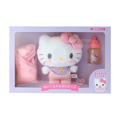 the hello kitty doll is in its box with her pink outfit and bottle next to it