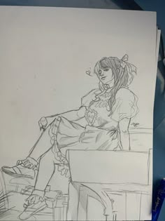 a pencil drawing of a woman sitting on a desk