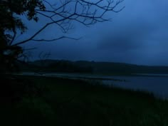 the dark sky is lit up by some water