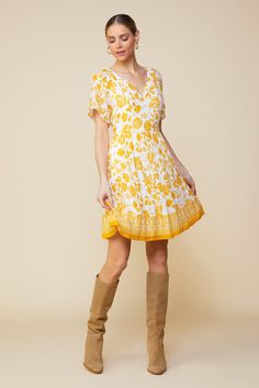 This printed babydoll dress is the embodiment of summer. It's sunny and easy, designed in a textural swiss dot fabric with a marigold floral print and a geometric border at the hem. •Split neckline •Short sleeves •Hidden side zipper Item Number: 99220 Swiss Dot Fabric, Swiss Dot Dress, Geometric Border, Dot Fabric, Dotted Fabric, Border Print, Swiss Dot, Printed Mini Dress, White Mini Dress