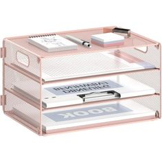 a pink drawer with three drawers and two pens on top of it, in front of a white background