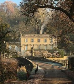 an old house in the middle of a wooded area