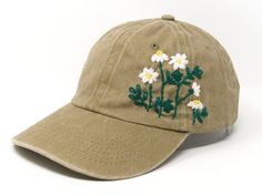 This hand embroidered flower baseball cap is a one-of-a-kind accessory that combines style and comfort. The cap is crafted from high-quality material, ensuring durability and comfort. The intricate floral design is hand-embroidered, giving each cap a unique touch and making it a standout piece. Whether you're running errands or enjoying a day outdoors, this cap will keep the sun out of your eyes in style. Flower is 100% hand embroidered on a 100% cotton wash gray baseball cap. Hat is one size fi Khaki Visor Hat For Spring, Khaki Visor Baseball Cap For Spring, Spring Khaki Cotton Baseball Cap, Vintage Khaki Hat For Spring, Khaki Baseball Cap With Embroidered Logo, Fern Flower, Burgundy Jeans, Summer Cap, Flower Hat