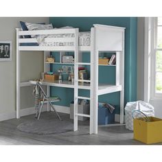 a white bunk bed sitting next to a blue wall